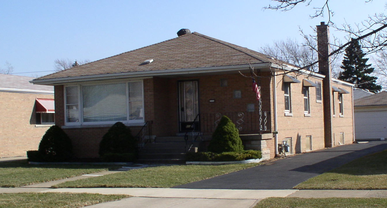 A real brick bungalow with a detached garage in southwest suburban Chicago